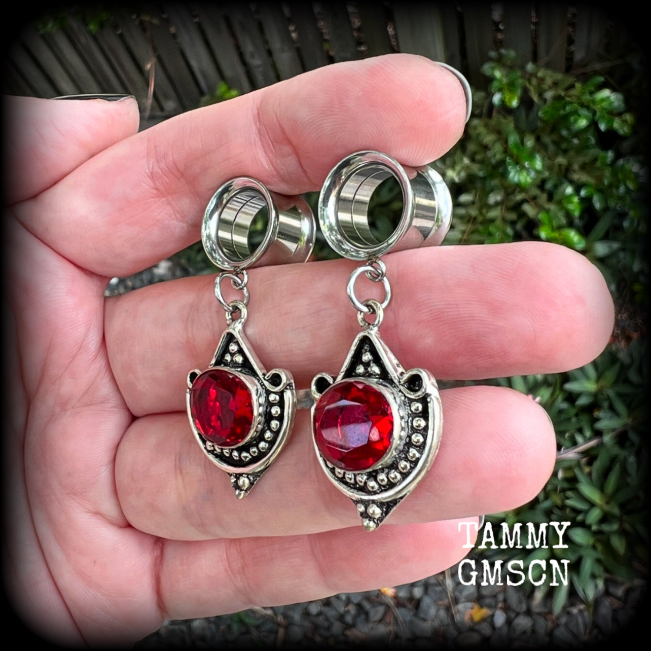 These beautiful earrings have been made with gorgeous deep red garnet gemstones in a beautiful boho antique silver setting, are nice and light weight, weighing approx 6 grams each and measuring 4.5 from tip to tip.

These gorgeous tunnel dangles have been made with 1/2" (12mm) gauge surgical steel screw fit earlets.