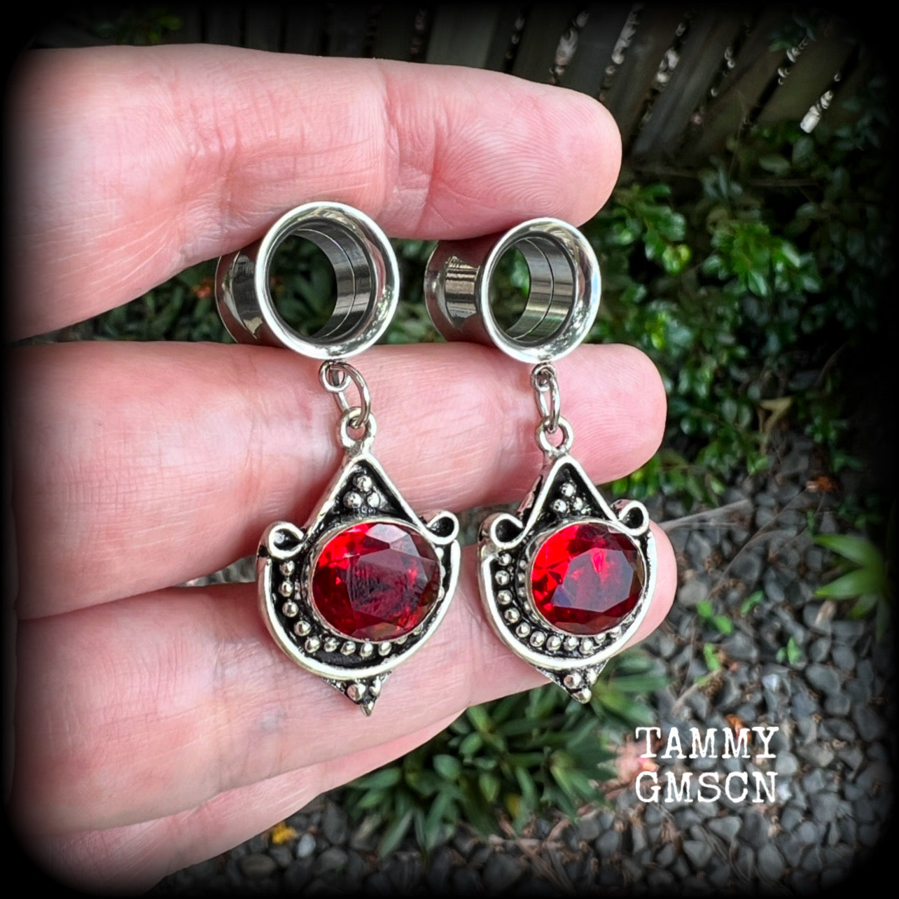 These beautiful earrings have been made with gorgeous deep red garnet gemstones in a beautiful boho antique silver setting, are nice and light weight, weighing approx 6 grams each and measuring 4.5 from tip to tip.

These gorgeous tunnel dangles have been made with 1/2" (12mm) gauge surgical steel screw fit earlets.