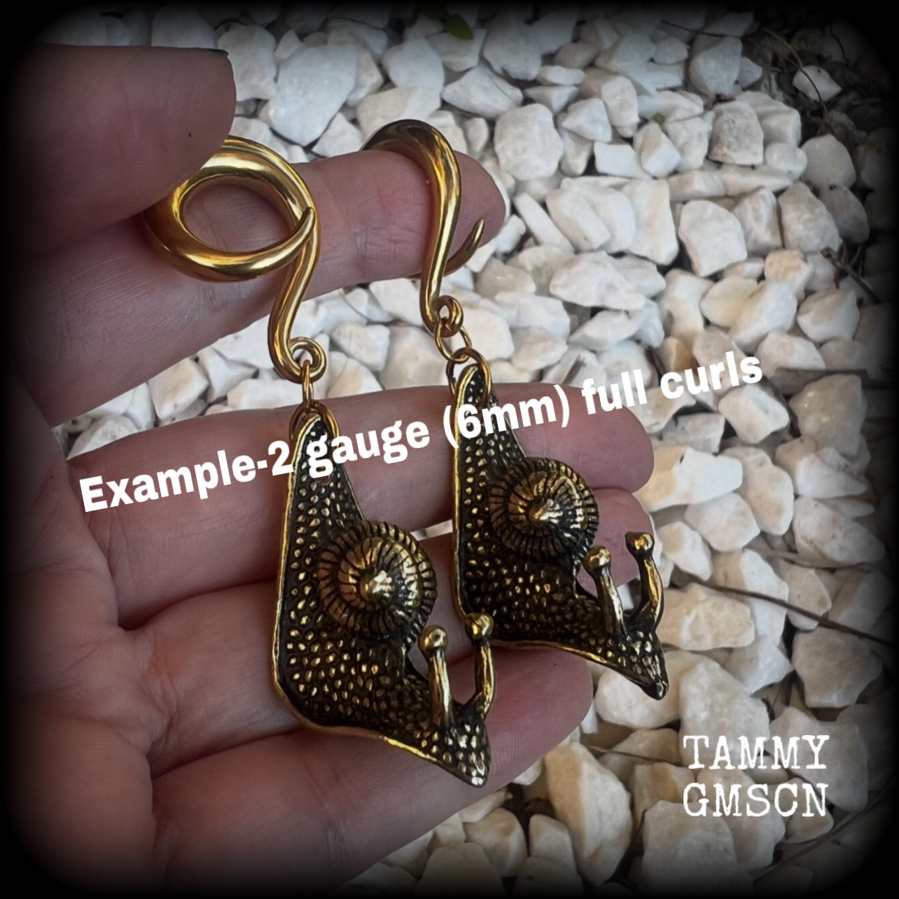 These awesome brass snail ear hangers feature gorgeous brass garden snails, measuring just on 7.5cms from tip to tip, and weighing approx 30 grams each.

This pair has been made on 2 gauge (6mm) surgical steel full curls, suitable for stretched lobes.