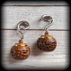 These beautifully carved Sandalwood stash pot earrings weigh in at only 15 grams a piece, and measure just on 6cms from tip to tip.
This pair has been made on 2 gauge (6mm) stainless steel full curled hooks, to be worn in stretched lobes.