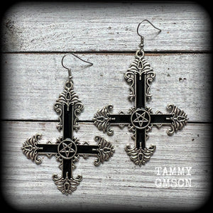 These gorgeous gothic earrings feature a black enamel inverted cross with a silver inverted pentagram, measuring just on 8.5 cms from tip to tip, and weigh approx 10 grams a piece.

This pair have been made on stainless steel french hooks, suitable for pierced ears.