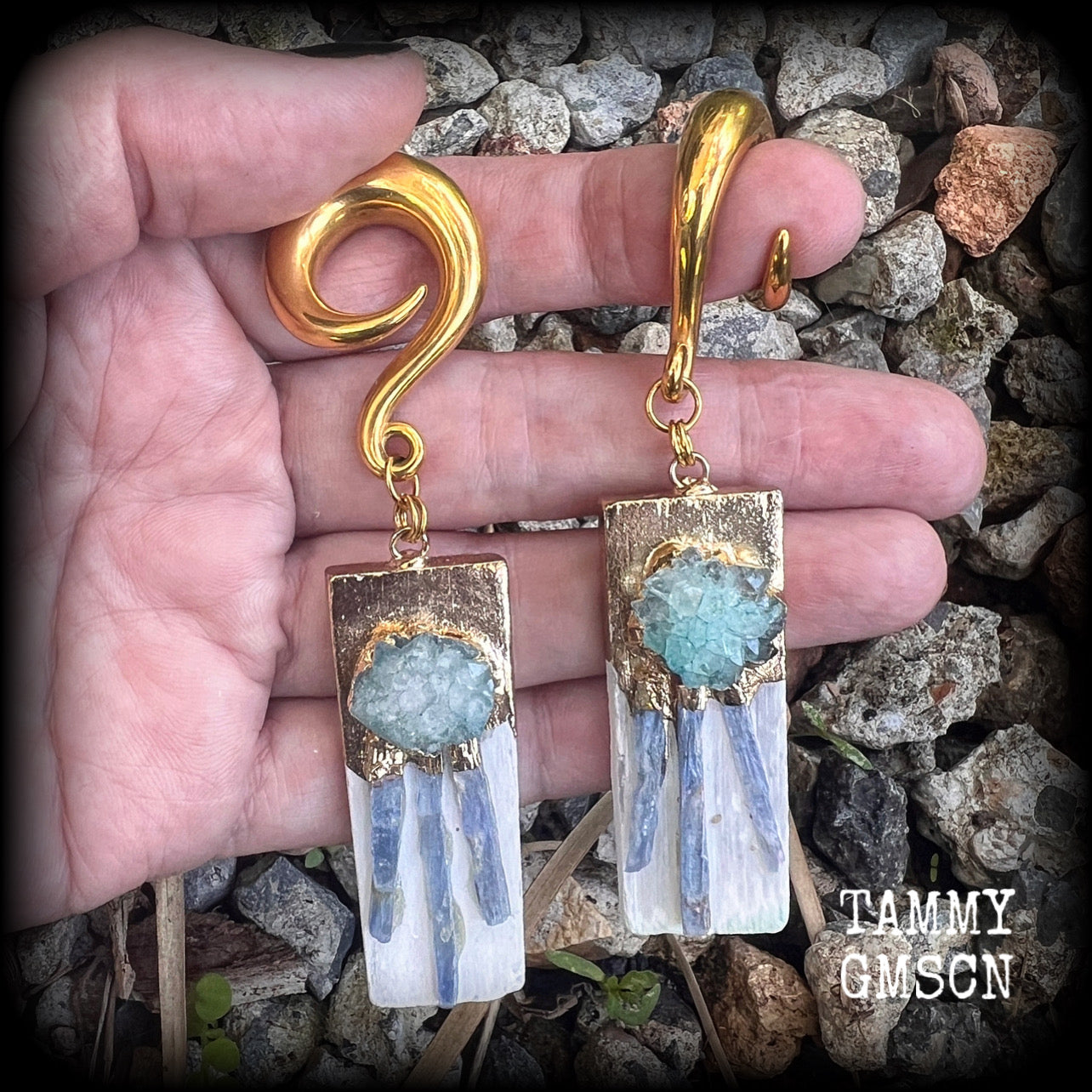 These unique gauged earrings feature selenite with ocean green druzy and sky blue kyanite, measuring approx 10cms from tip to tip, and weighing approx 25 grams each.

This pair have been made on 0 gauge (8mm) surgical steel full curl hooks, to be worn in stretched lobes.