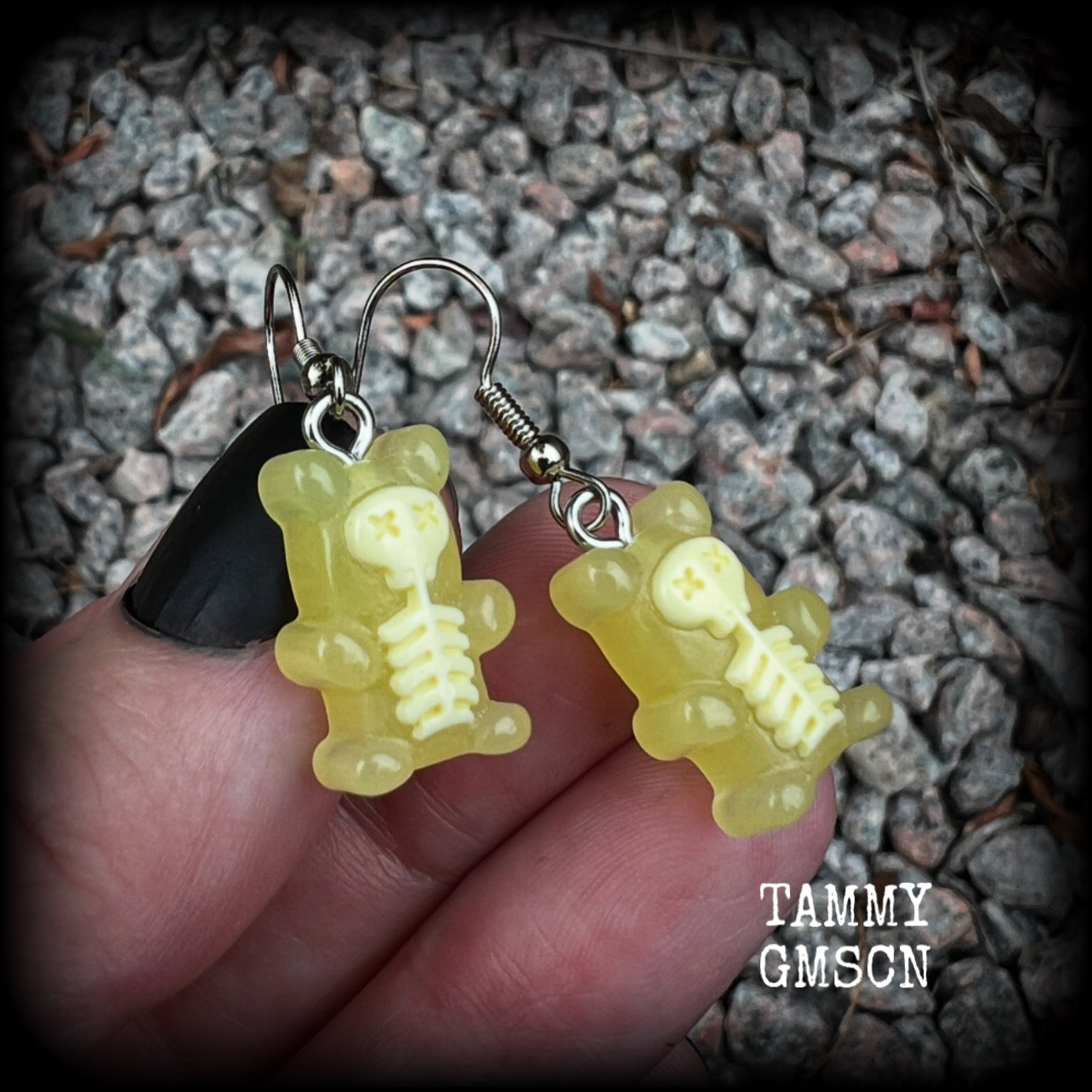 Featuring spooky cute yellow skeleton gummy bears, these adorable earrings measure just on 5cms from tip to tip and are super light weight, weighing only a gram or two each.

This pair has been made with stainless steel french hooks, to be worn in pierced ears.