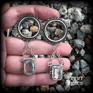 These gorgeous tunnel dangles feature beautiful dangly topaz gemstones set in antique silver, weighing approx 12 grams each and measuring just on 7cms from tip to tip.

This pair has been made with 3/4” gauge (19mm) surgical steel ornate tunnels-for stretched lobes.

