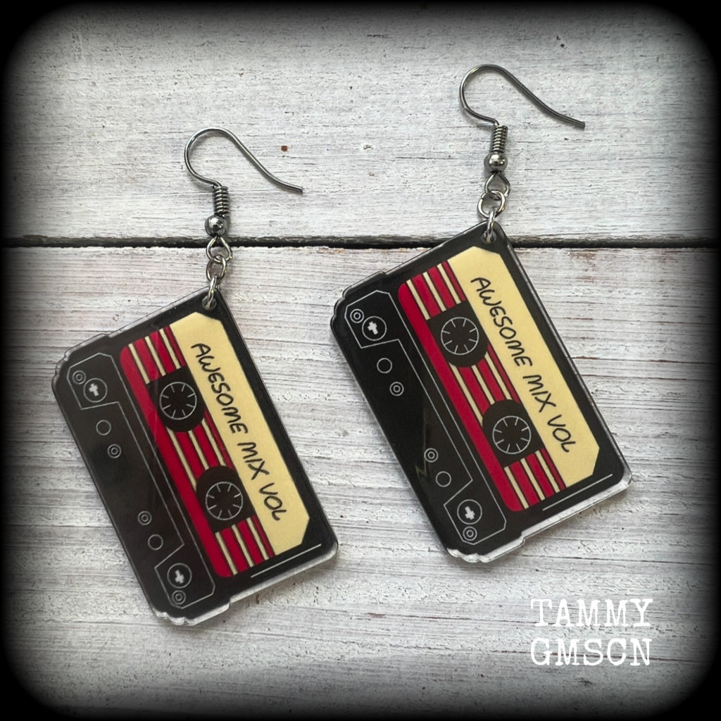 This awesome pair of earrings features a pair of classic 80’s mix tapes, are nice and lightweight weighing only a few grams each, and measure approx 7cms from tip to tip.

This pair has been made on stainless steel french hooks, suitable for pierced ears.