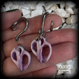 These gorgeous gauged earrings feature beautiful purple sea shell slices, weighing in approx 5 grams a piece, and measuring approx 5.5cms from tip to tip.

This pair has been made on 6 gauge (4mm) surgical steel full curl hooks, to be worn in stretched lobes.