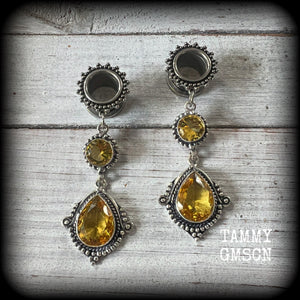 These gorgeous boho tunnel earrings have been made with beautiful yellow citrine gemstones in an antique silver setting, are light weight weighing approx 11 grams each and measure just over 7cms from tip to tip.

This pair have been made with 1/2” gauge (12mm) ornate surgical steel screw fit tunnels, for stretched lobes.