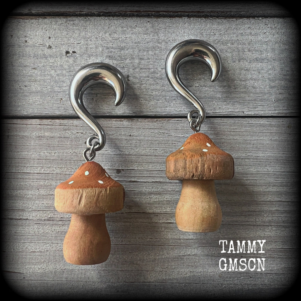 This pair of gauged earrings features gorgeous golden yellow wood mushrooms, not too heavy at 13 grams a piece, and nice and dangly at just on 7cms from tip to tip.

This pair has been made on 0 gauge (8mm) surgical steel half curl hooks, suitable for stretched lobes.