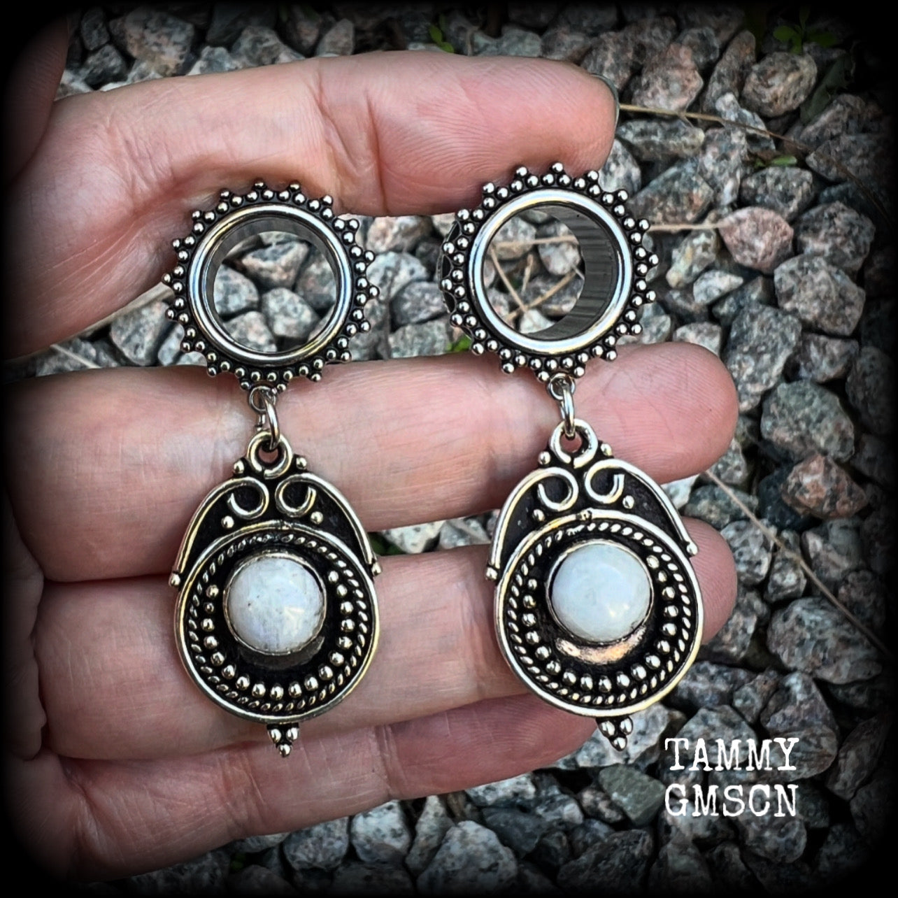 These earrings feature beautiful polished rainbow moonstone gemstones in a gypsy boho antique silver setting, are light weight weighing approx 11 grams each and measuring just on 5.5cms from tip to tip.  This pair has been made with 9/16” gauge (14mm) gauge ornate surgical steel screw fit tunnels, for stretched lobes.