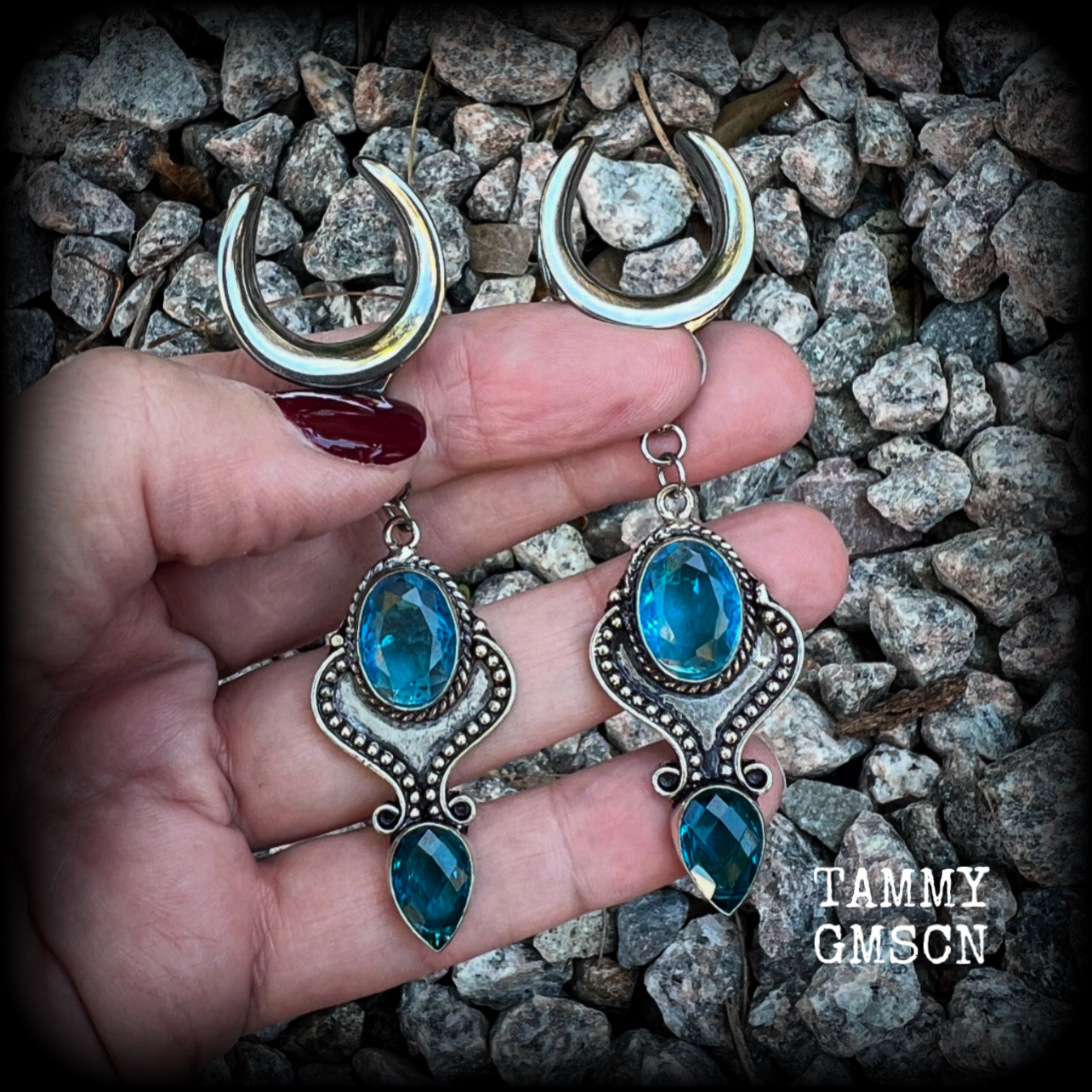 These earrings feature gorgeous facet blue topaz gemstones in a beautiful boho antique silver setting, lovely and dangly at just on 8cms from tip to tip, and not too heavy at 12 grams each.

These earrings have been made on 3/4” gauge (19mm) surgical steel cradles, to be worn in stretched lobes.