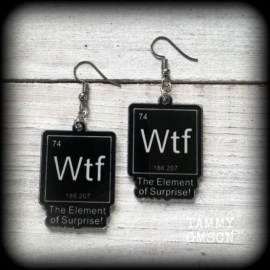 This cheeky pair of earrings features acrylic letter tiles showing the chemical element of Wtf, the Element of Surprise!!!
Measuring just over 6cms from tip to tip, these earrings weigh only a few grams each.

This pair has been made with stainless steel french hooks, suitable for pierced ears.