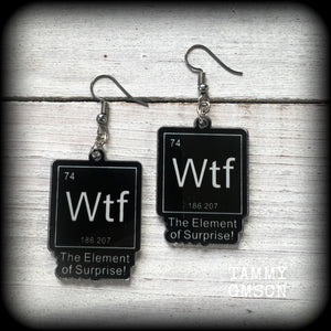 This cheeky pair of earrings features acrylic letter tiles showing the chemical element of Wtf, the Element of Surprise!!!
Measuring just over 6cms from tip to tip, these earrings weigh only a few grams each.

This pair has been made with stainless steel french hooks, suitable for pierced ears.