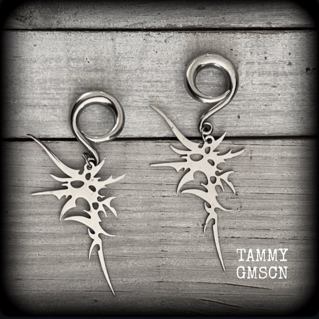 These awesome punk rock earrings feature stainless steel cybersigils, weighing approx 9 grams a piece, and nice and dangly on 8cms from tip to tip.

This pair has been made on 2 gauge (6mm) surgical steel full curl hooks, suitable for stretched lobes.
