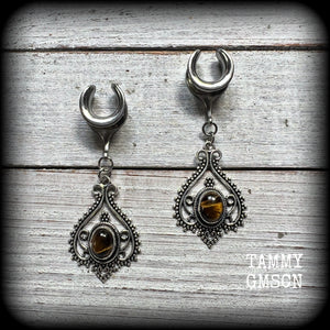 These earrings feature beautiful tigers eye gemstones in a gorgeous boho antique silver setting, lovely and petite at 6cms from tip to tip, and weighing approx 6 grams each.
These earrings have been made on 1/2” gauge (12mm) surgical steel cradles, to be worn in stretched lobes.
