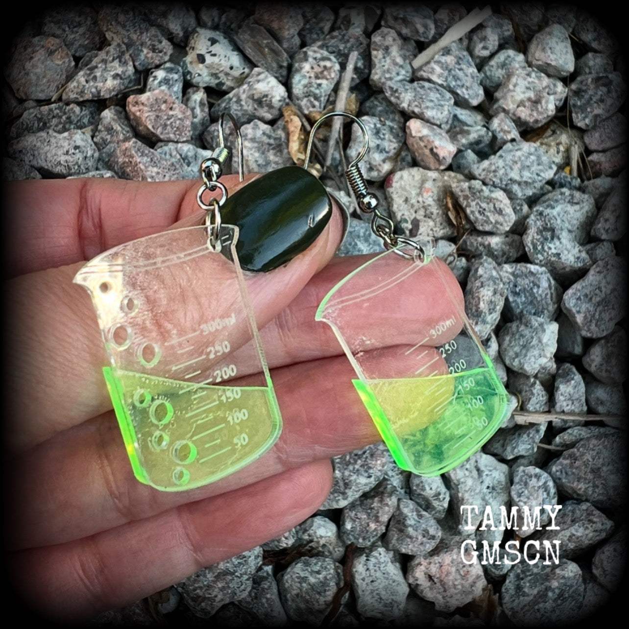 This pair of earrings features a pair of absolutely adorable classic Griffin chemistry beakers full of bubbly green liquid, measuring just under 6cms from tip to tip and weighing only a few grams each.

This pair have been made on stainless steel french hooks, suitable for pierced ears.