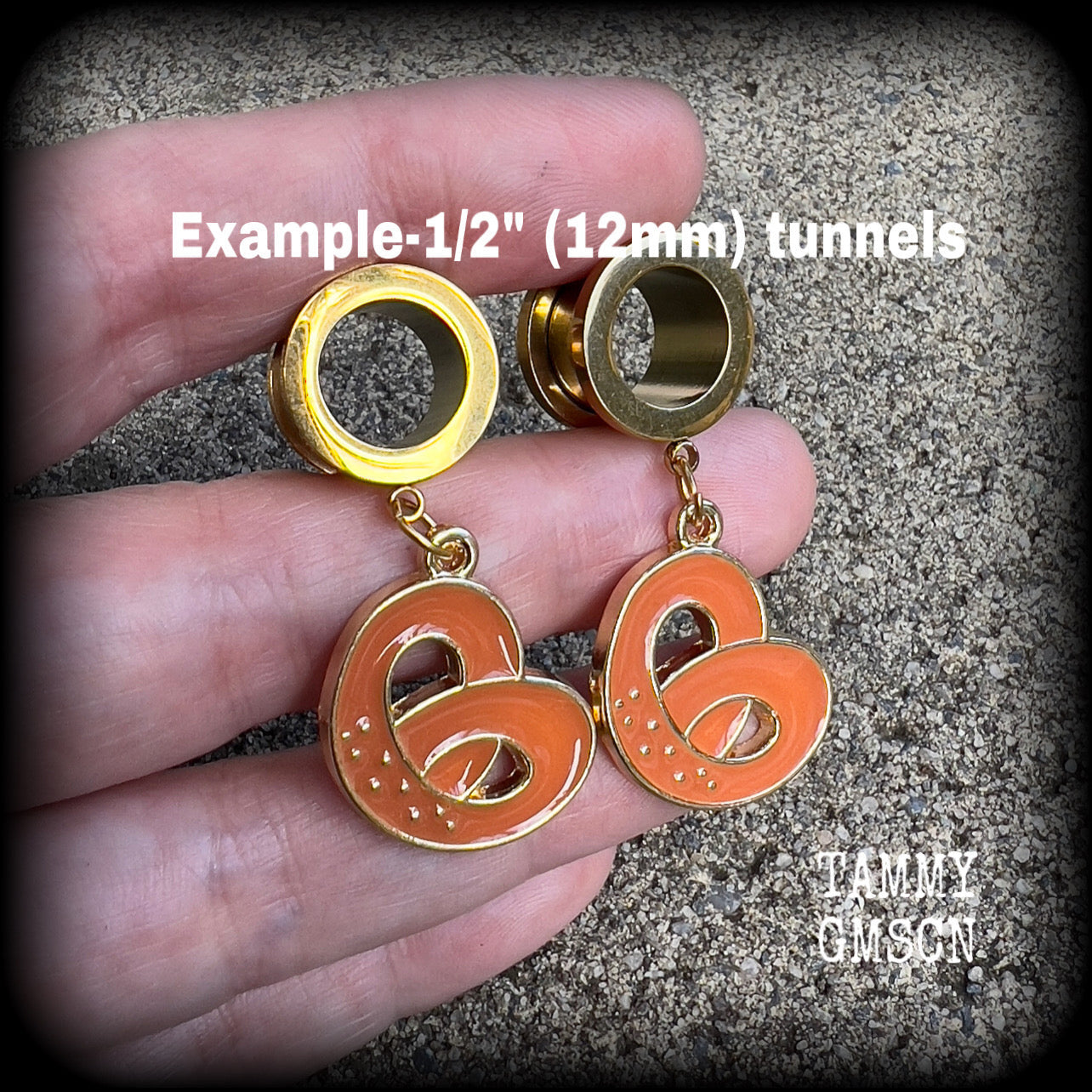 These adorable tunnel earrings feature classic enamel and antique gold pretzel charms, weighing approx 5 grams each, and measuring just over 4 cms from tip to tip.

This pair has been made with 1/2” gauge (12mm) surgical steel screw fit tunnels, to be worn in stretched lobes.