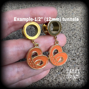 These adorable tunnel earrings feature classic enamel and antique gold pretzel charms, weighing approx 5 grams each, and measuring just over 4 cms from tip to tip.

This pair has been made with 1/2” gauge (12mm) surgical steel screw fit tunnels, to be worn in stretched lobes.