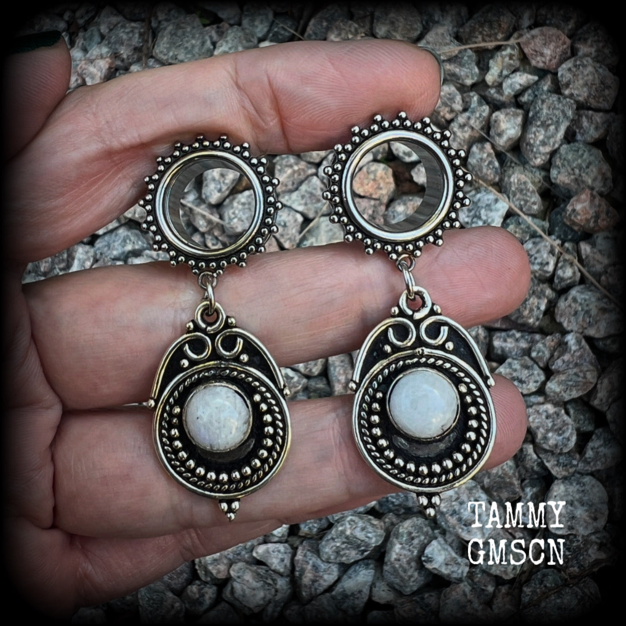These earrings feature beautiful polished rainbow moonstone gemstones in a gypsy boho antique silver setting, are light weight weighing approx 11 grams each and measuring just on 5.5cms from tip to tip.  This pair has been made with 9/16” gauge (14mm) gauge ornate surgical steel screw fit tunnels, for stretched lobes.