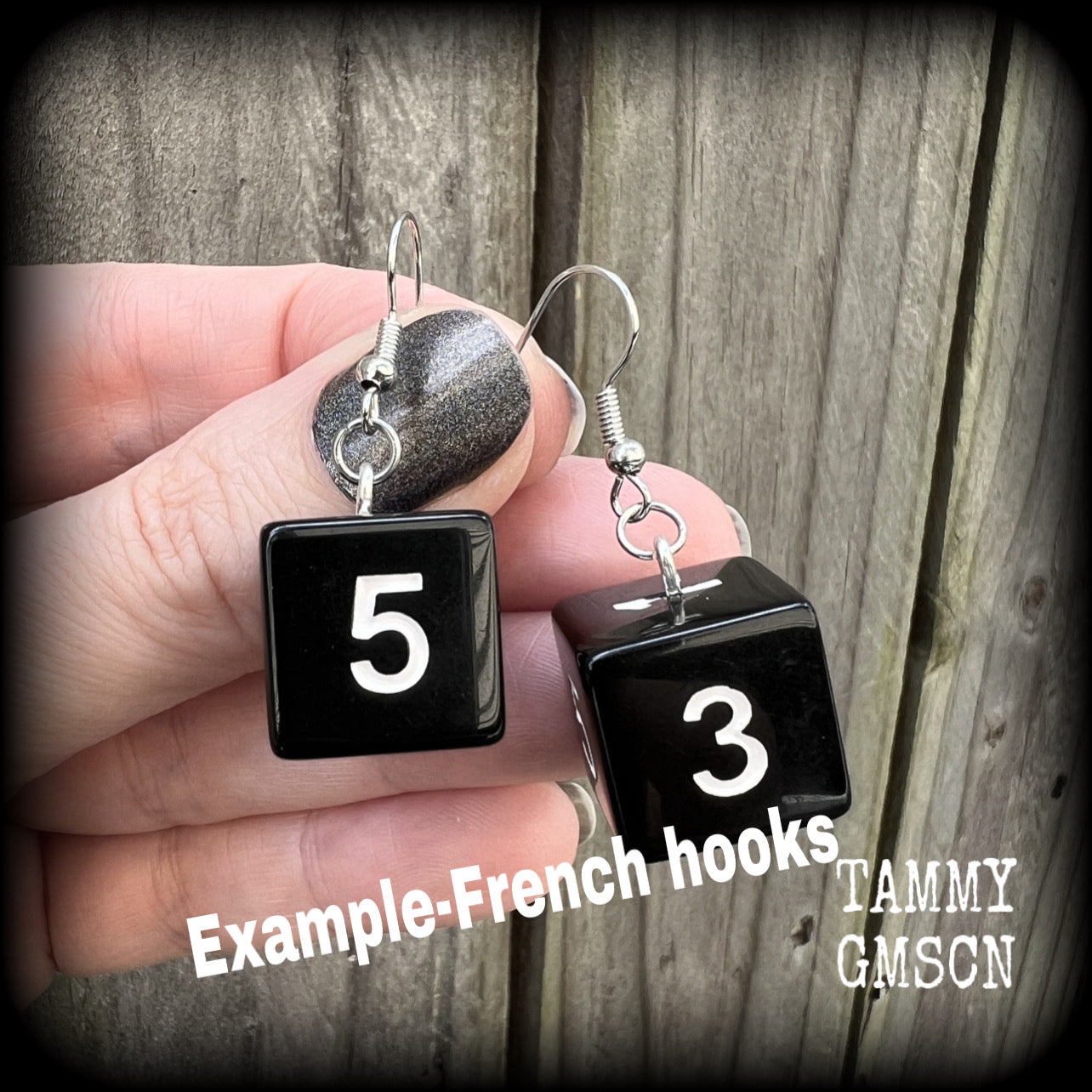 Featuring a pair of pitch black gamer dice, these super nerdy earrings measure just on 4cm from tip to tip and weigh approx 5 grams each.

This pair have been made with stainless steel french hooks, suitable for pierced ears.