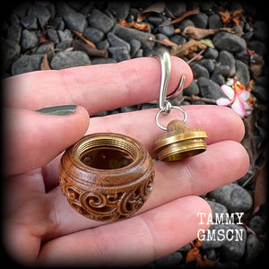 These beautifully carved Sandalwood stash pot earrings weigh in at only 15 grams a piece, and measure just on 6cms from tip to tip.
This pair has been made on 2 gauge (6mm) stainless steel full curled hooks, to be worn in stretched lobes.