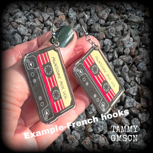 This awesome pair of earrings features a pair of classic 80’s mix tapes, are nice and lightweight weighing only a few grams each, and measure approx 7cms from tip to tip.

This pair has been made on stainless steel french hooks, suitable for pierced ears.