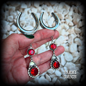 These beautiful boho Garnet ear hangers are made with gorgeous facet gemstones in a beautiful boho antique silver setting, measuring just on 10cm from tip to tip, and weighing 18 grams each, nice and lightweight. 

These earrings have been made on 1.18" gauge (30mm) surgical steel cradles, to be worn in stretched lobes.
