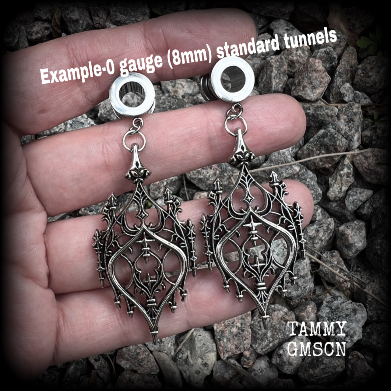These gorgeous gothic tunnel earrings feature a beautiful antique silver ornate gothic cathedral architectural arch, measuring just on 7cms from tip to tip, and weighing approx 10 grams each.

This pair has been made on 0 gauge (8mm) surgical steel screw fit tunnels.