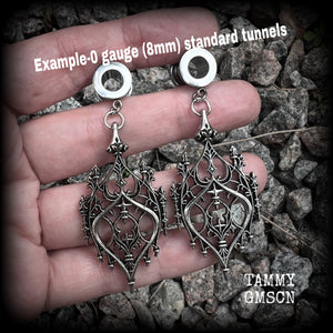 These gorgeous gothic tunnel earrings feature a beautiful antique silver ornate gothic cathedral architectural arch, measuring just on 7cms from tip to tip, and weighing approx 10 grams each.

This pair has been made on 0 gauge (8mm) surgical steel screw fit tunnels.