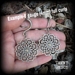 These beautiful antique silver mandala gauged earrings are nice and light weight, weighing approx 6 grams a piece, measuring approx 6cms from tip to tip.

This pair have been made on 6 gauge (4mm) surgical steel full curl hooks, suitable for stretched lobes.