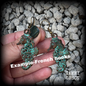 This pair of earrings features a gorgeous antique verdigris patina seahorse, measuring just under 6cms from tip to tip, and weighing 7 grams each.

This pair has been made with french hooks, for pierced ears.