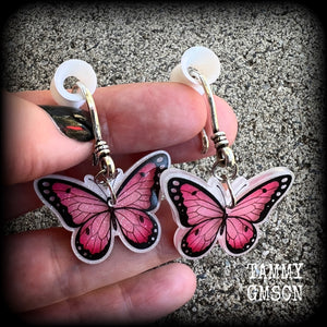 This is a pair of beautiful pink butterfly earrings, available on a selection of hooks and clasps for pierced ears and stretched lobes.