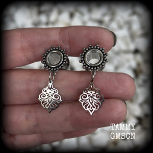These beautiful ornate tunnel earrings feature gorgeous stainless steel filigree charms, inspired by Aphrodite, the Greek Goddess of love and beauty.

These earrings are nice and lightweight, weighing only a few grams each and measure just under 4cms from tip to tip.

This pair has been made with 0 gauge (8mm) gauge ornate surgical steel screw fit tunnels.