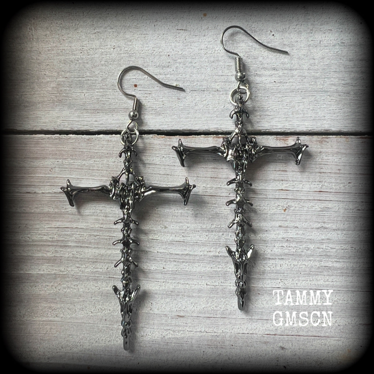 These gorgeous gothic earrings feature gunmetal grey skeleton crosses, measuring just over 8 cms from tip to tip, and weigh approx 7 grams a piece.

This pair have been made on stainless steel french hooks, suitable for pierced ears.