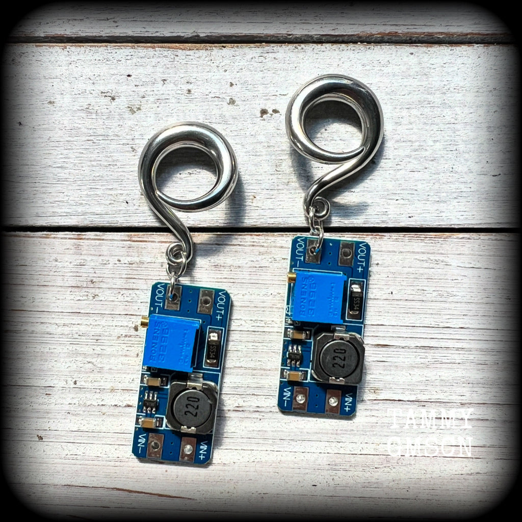 These awesome earrings feature pieces of blue circuitry, are nice and dangly, measuring just on 7cms from tip to tip, and nice and light weight, weighing approx 12 grams each.

This pair has been made on 2 gauge (6mm) surgical steel full curl hooks, to be worn in stretched lobes.