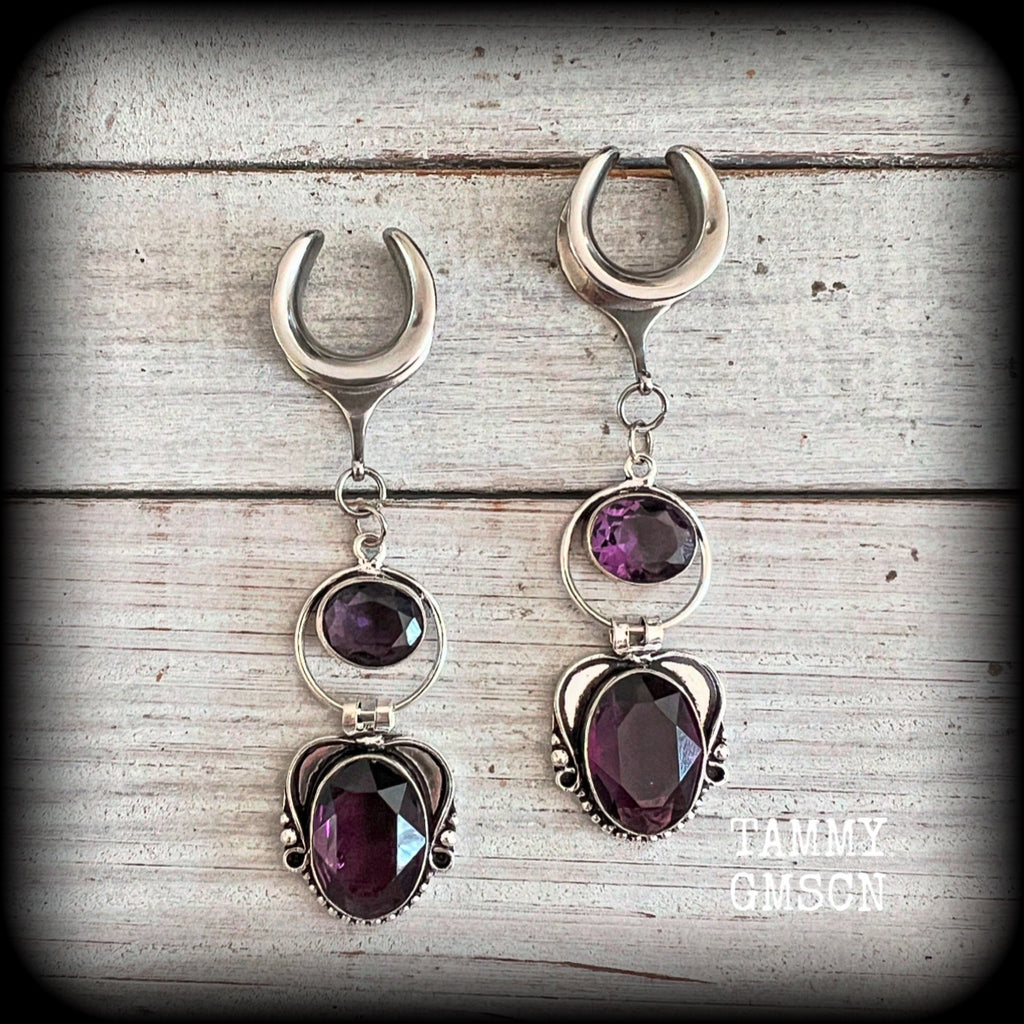 These gorgeous gauged earrings feature beautiful purple facet amethyst gemstones in an antique silver gypsy boho style setting, measuring just on 6cms from tip to tip, and weighing approx 6 grams each, not too heavy...

This pair have been made on 5/8” gauge (16mm) surgical steel cradles-suitable for stretched lobes.
