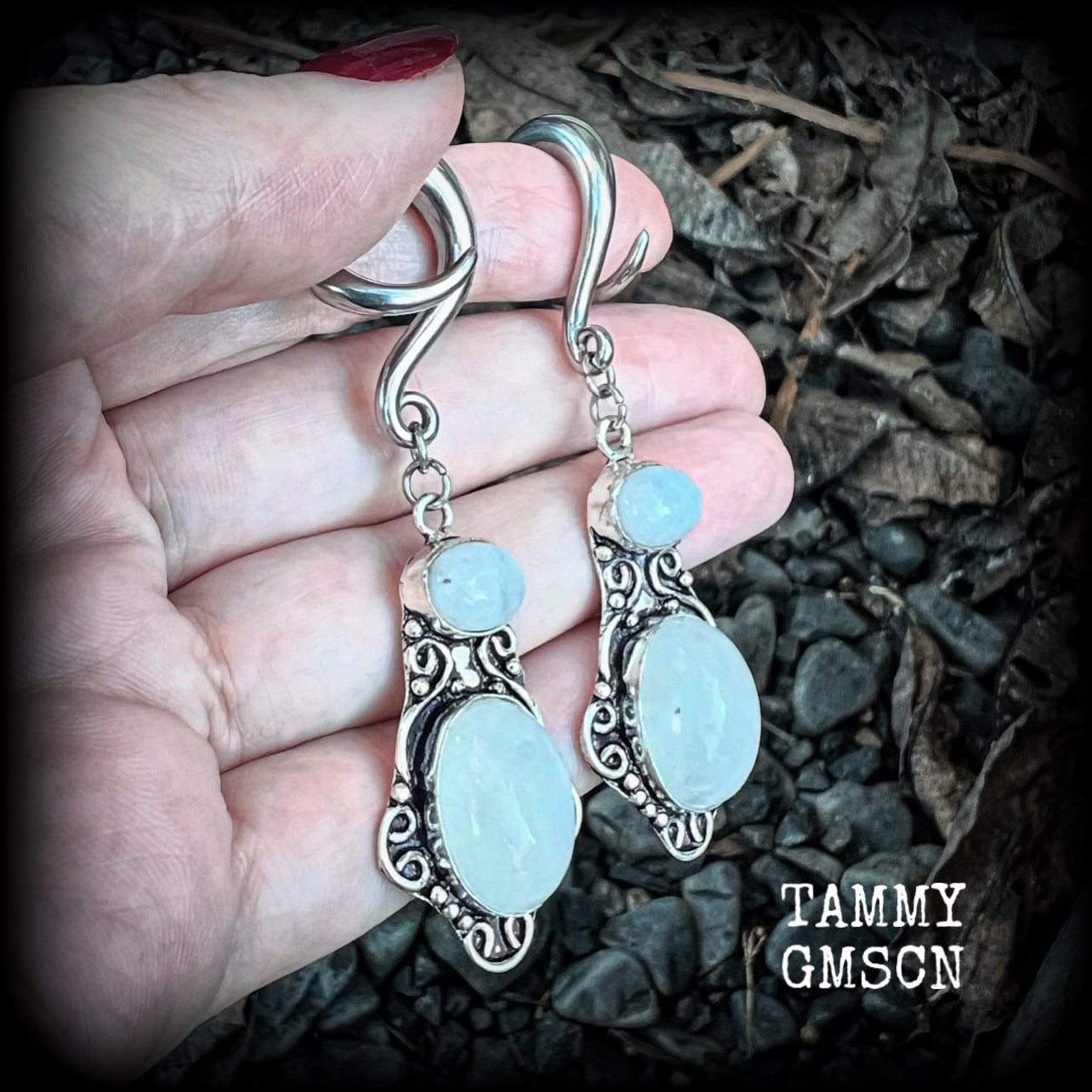 These gemstone earrings feature beautiful big rainbow moonstones in a beautiful antique silver setting.  These earrings are lovely and dangly measuring 8cms from tip to tip, and weighing 14 grams each. Made on 2 gauge (6mm) surgical steel full curls.