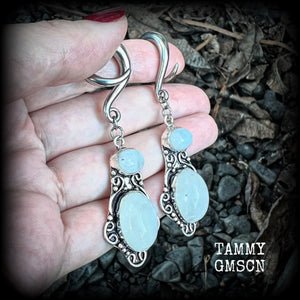 These gemstone earrings feature beautiful big rainbow moonstones in a beautiful antique silver setting.  These earrings are lovely and dangly measuring 8cms from tip to tip, and weighing 14 grams each. Made on 2 gauge (6mm) surgical steel full curls.