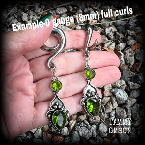 This pair of earrings features gorgeous green quartz and peridot gemstones in a boho antique silver setting, weighing approx 19 grams a piece and measuring just on 8.5cms from tip to tip.  This pair have been made on 0 gauge (8mm) surgical steel full curl hooks, to be worn in stretched lobes.