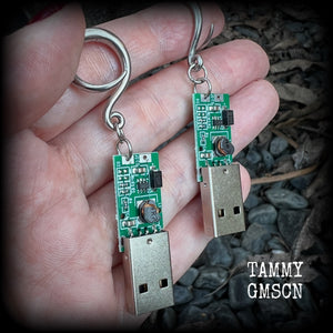 These awesome earrings feature a classic green USB, are nice and dangly, measuring approx 7cms from tip to tip, and nice and light weight, weighing only 6 grams each.

This pair has been made on 6 gauge (4mm) surgical steel full curl hooks, to be worn in stretched lobes.