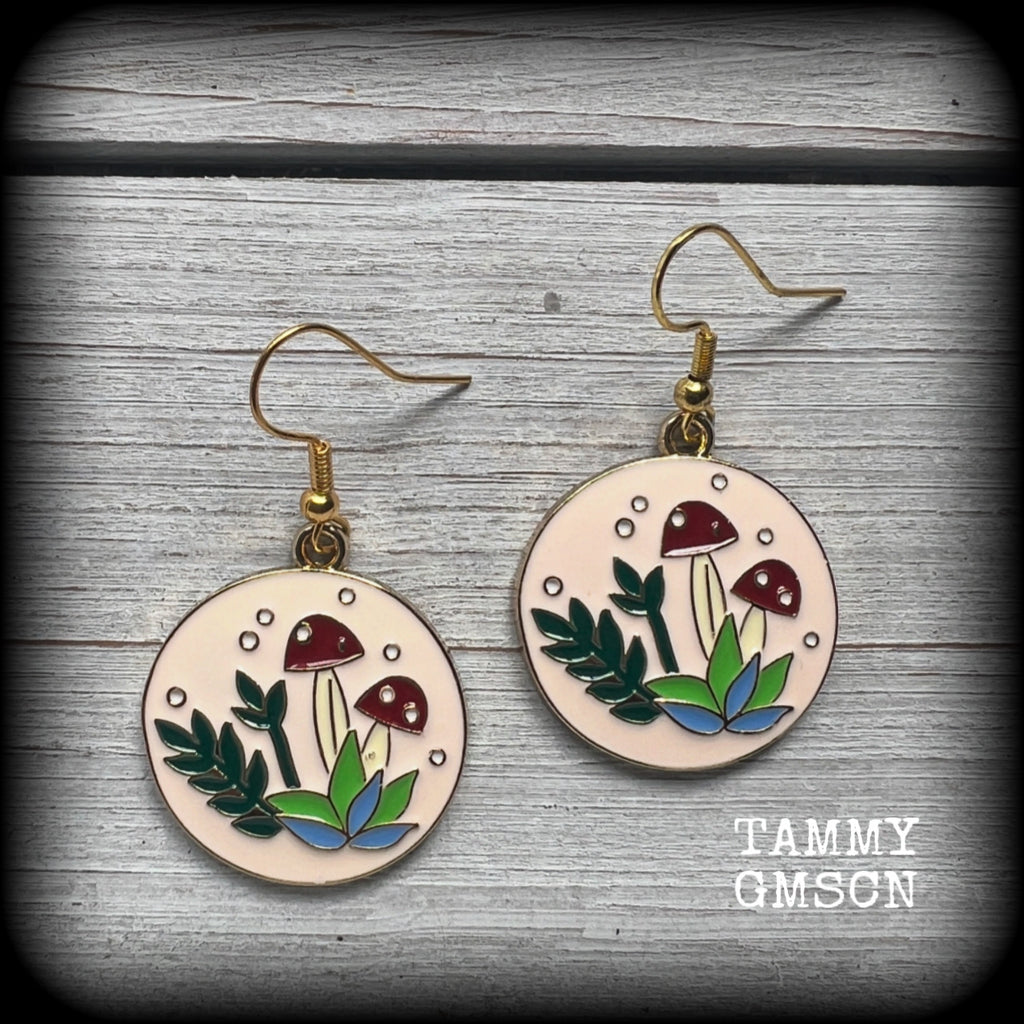 These adorable antique gold and enamel toadstool earrings measure in at just under 5cm, are nice and light, weighing only a few grams each.

This pair has been made with antique gold french hooks, suitable for pierced ears.