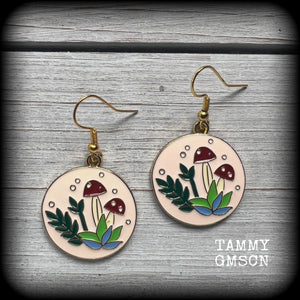 These adorable antique gold and enamel toadstool earrings measure in at just under 5cm, are nice and light, weighing only a few grams each.

This pair has been made with antique gold french hooks, suitable for pierced ears.