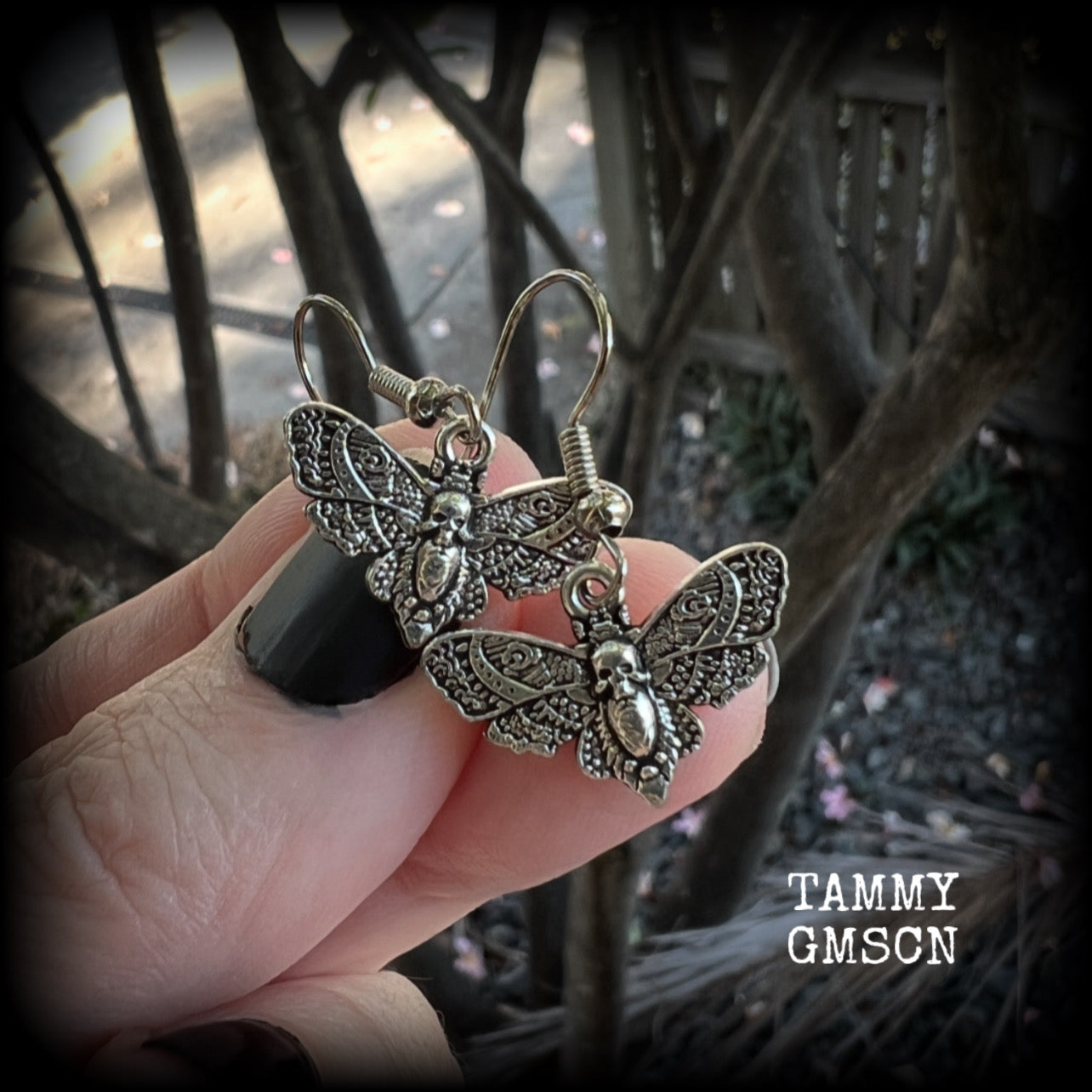 These petite antique silver Deathshead moth earrings feature a gorgeous gothic deathshead moth charm measuring just on 3cms, and weigh only a gram or two each.

This pair has been made on stainless steel french hooks, for pierced ears.