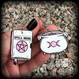 These awesome spooky cute pastel goth earrings feature baby pink and white witches spell books and cauldron charms, are nice and light weight at only a few grams each, and are nice and dangly, measuring just on 6cms from tip to tip.  This pair has been made on with stainless steel french hooks, suitable for pierced ears.