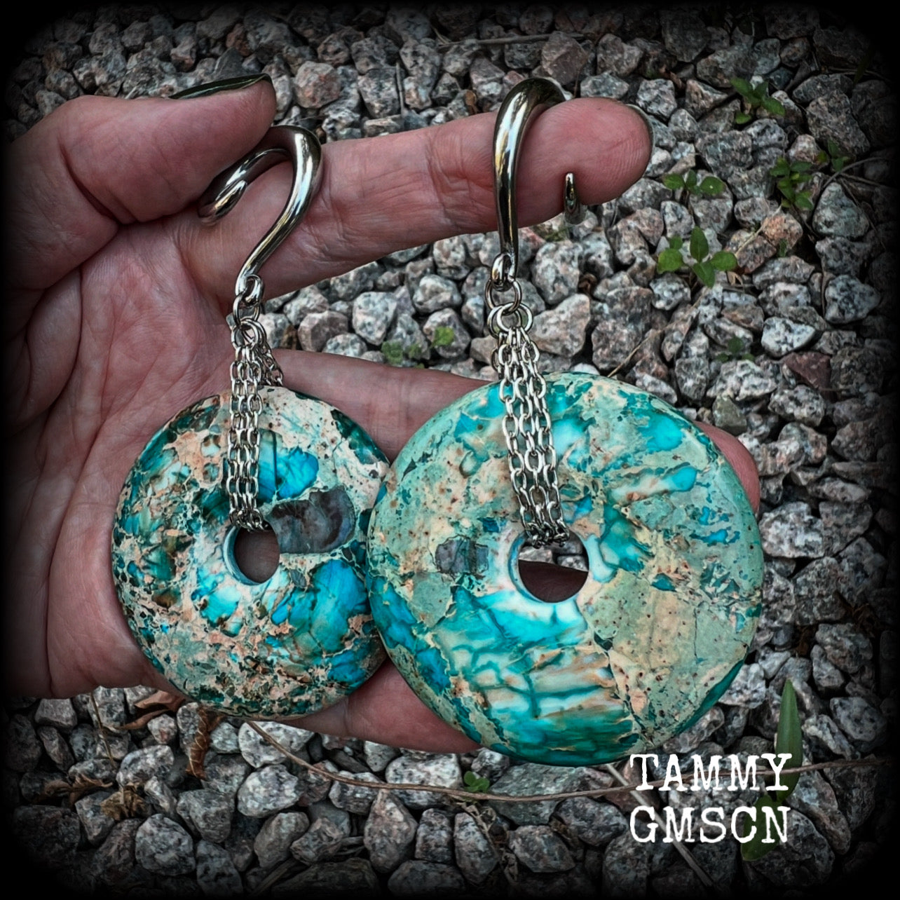 These ear weights feature gorgeous Turquoise ocean jasper donut gemstones cradled in antique silver chain, measuring just over 9cms from tip to tip, and weighing approx 40 grams each. 

This pair have been made on 2 gauge (6mm) surgical steel full curls, to be worn in stretched lobes.