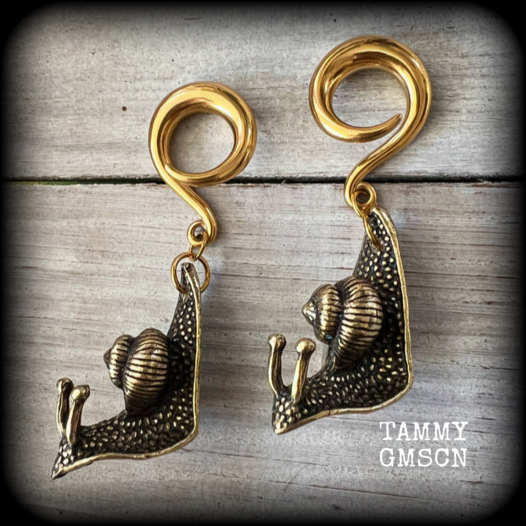 These awesome brass snail ear hangers feature gorgeous brass garden snails, measuring just on 7.5cms from tip to tip, and weighing approx 30 grams each.

This pair has been made on 2 gauge (6mm) surgical steel full curls, suitable for stretched lobes.