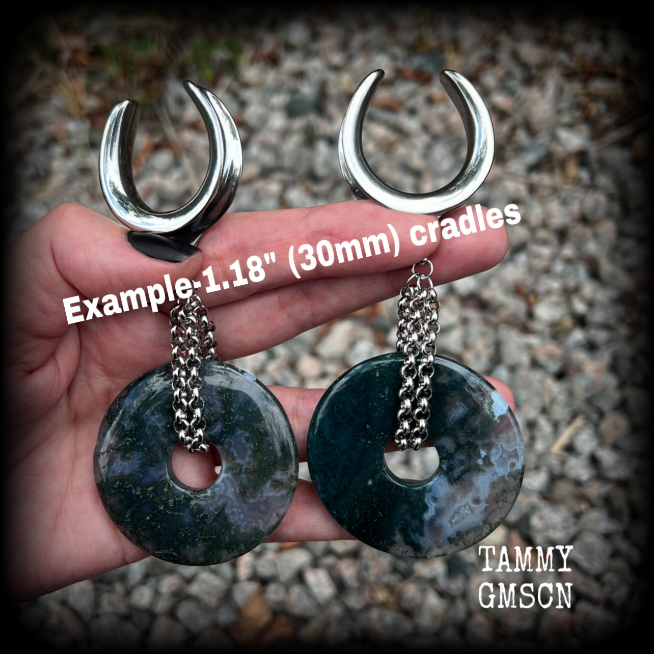 This pair of gorgeous gauged earrings features a pair of unique moss agate gemstone donuts cradled in antique silver chain, weighing approx 39 grams a piece and measuring just over 11cms from tip to tip.

These have been made on 1.18” gauge (30mm) surgical steel cradles, suitable for stretched lobes.