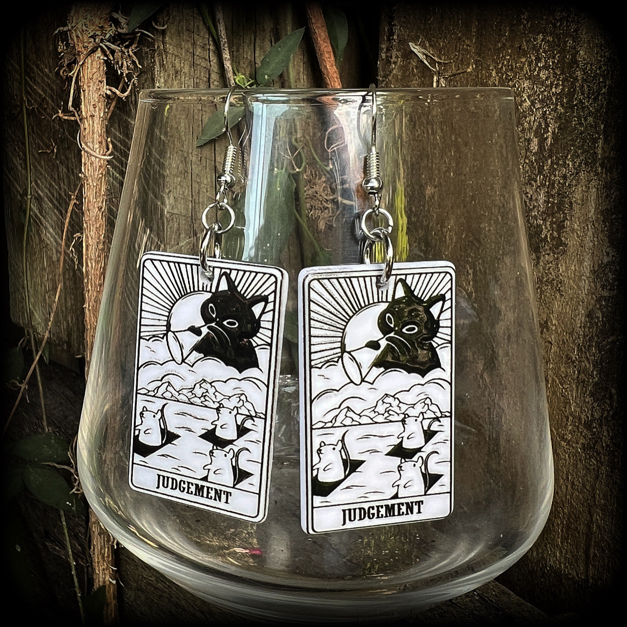 These adorable 'Judgement' tarot card earrings feature a lightweight tarot card charm, weighing only a few grams each, and measure approx 5cms from tip to tip.
This pair has been made with stainless steel french hooks, for pierced ears.