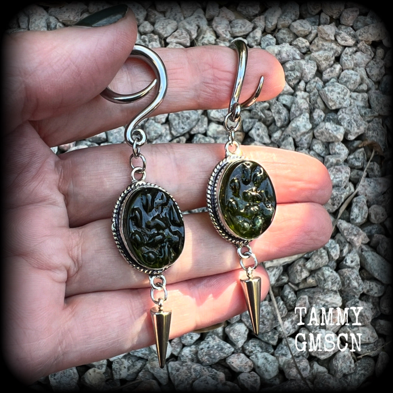 This pair of earrings features gorgeous forest green moldavite gemstones in a boho antique silver setting, weighing approx 10 grams a piece and measuring just on 8cms from tip to tip.  This pair have been made on 6 gauge (4mm) surgical steel full curl hooks, to be worn in stretched lobes.