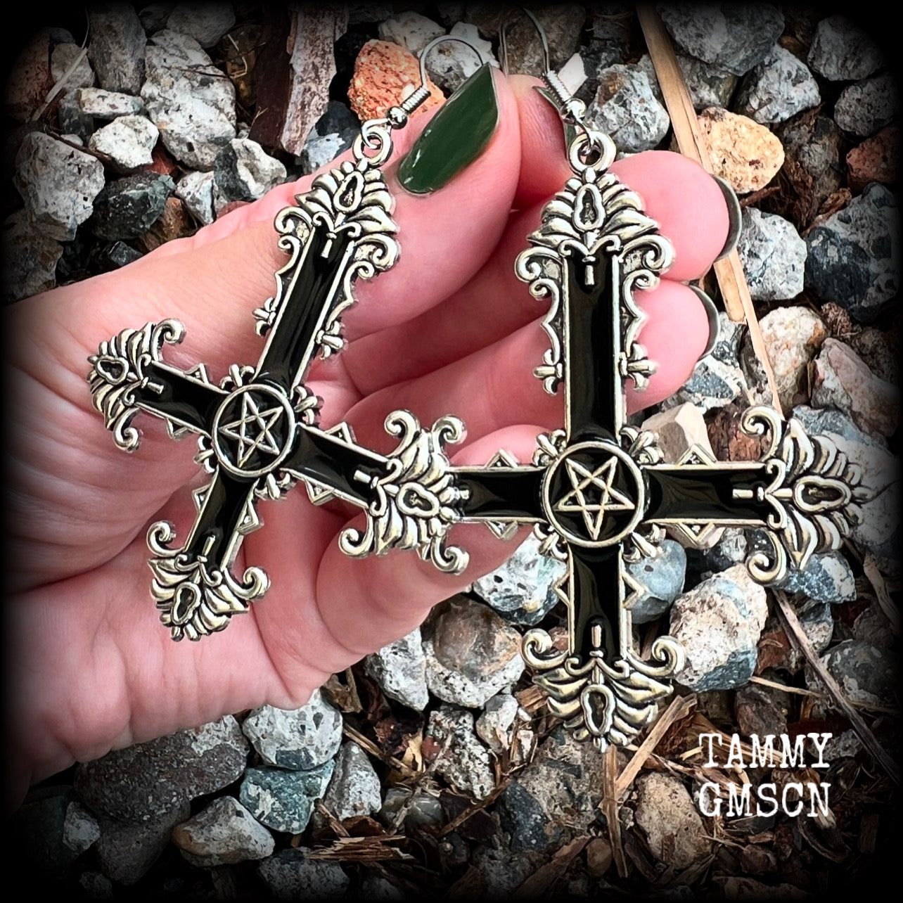 These gorgeous gothic earrings feature a black enamel inverted cross with a silver inverted pentagram, measuring just on 8.5 cms from tip to tip, and weigh approx 10 grams a piece.

This pair have been made on stainless steel french hooks, suitable for pierced ears.