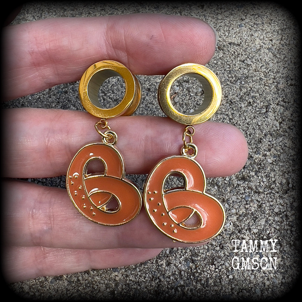 These adorable tunnel earrings feature classic enamel and antique gold pretzel charms, weighing approx 5 grams each, and measuring just over 4 cms from tip to tip.

This pair has been made with 1/2” gauge (12mm) surgical steel screw fit tunnels, to be worn in stretched lobes.